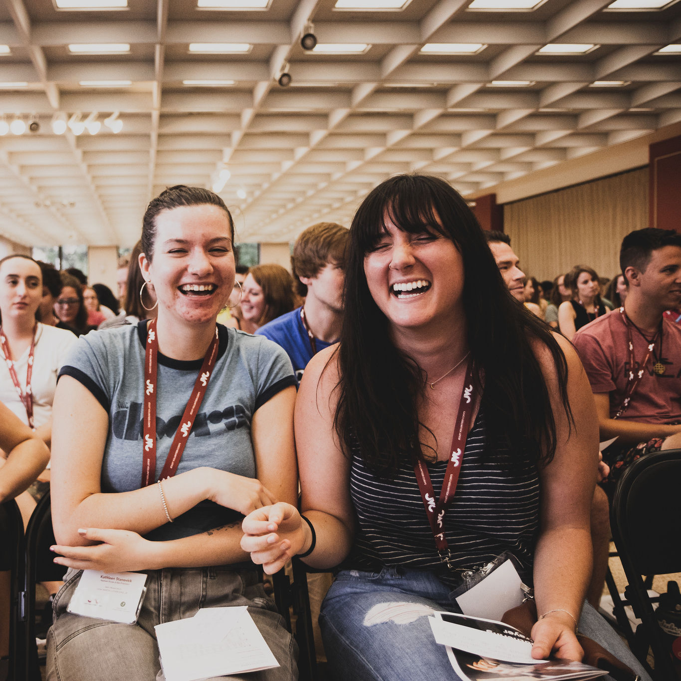 Jesuit Volunteers laugh while seated at Orientation 2018 in Chicago.