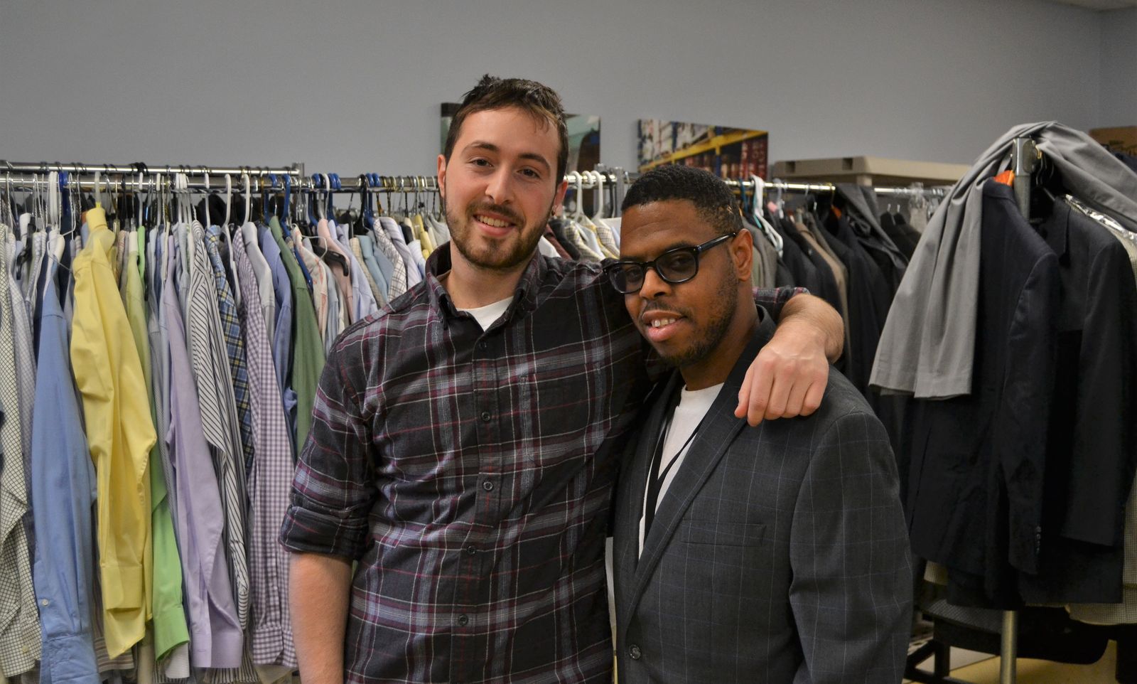 Former Jesuit Volunteer Gabe McCarthy (2017-18) helps Erik Cheeks find a suit for an upcoming job interview.