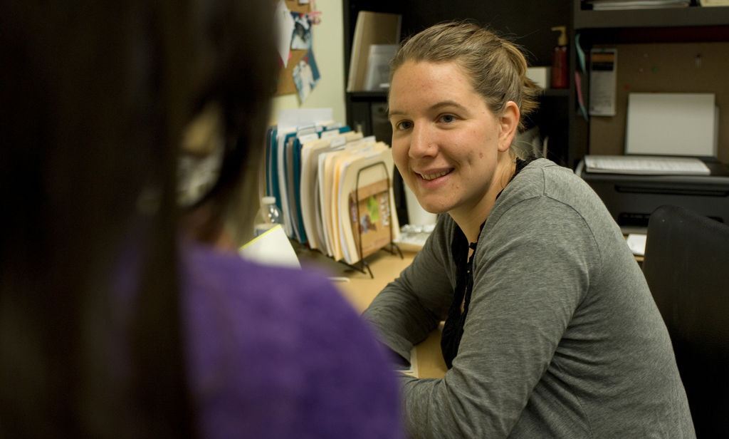 Jesuit Volunteer at Homeboy Industries performing vital service with a client. (2010)