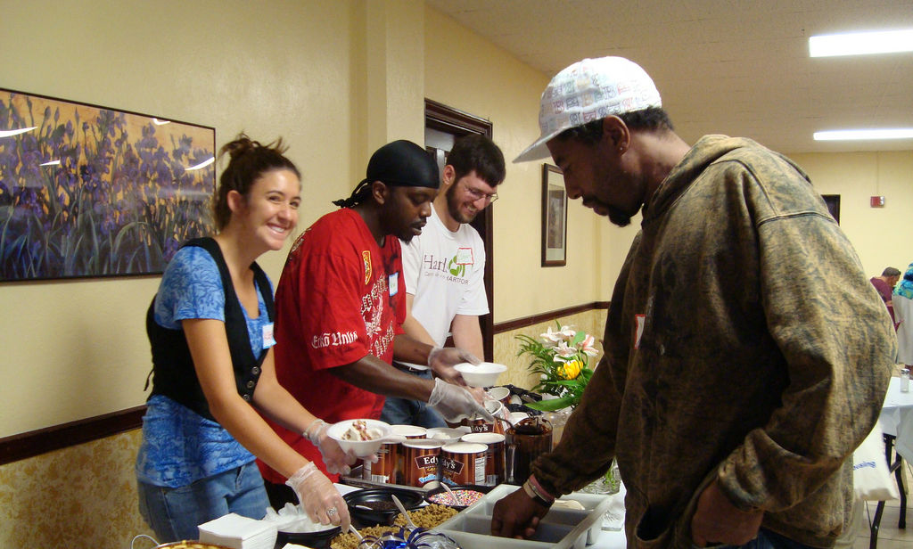 Katie Gosen (Hartford 2009) serving food at JV placement site.
