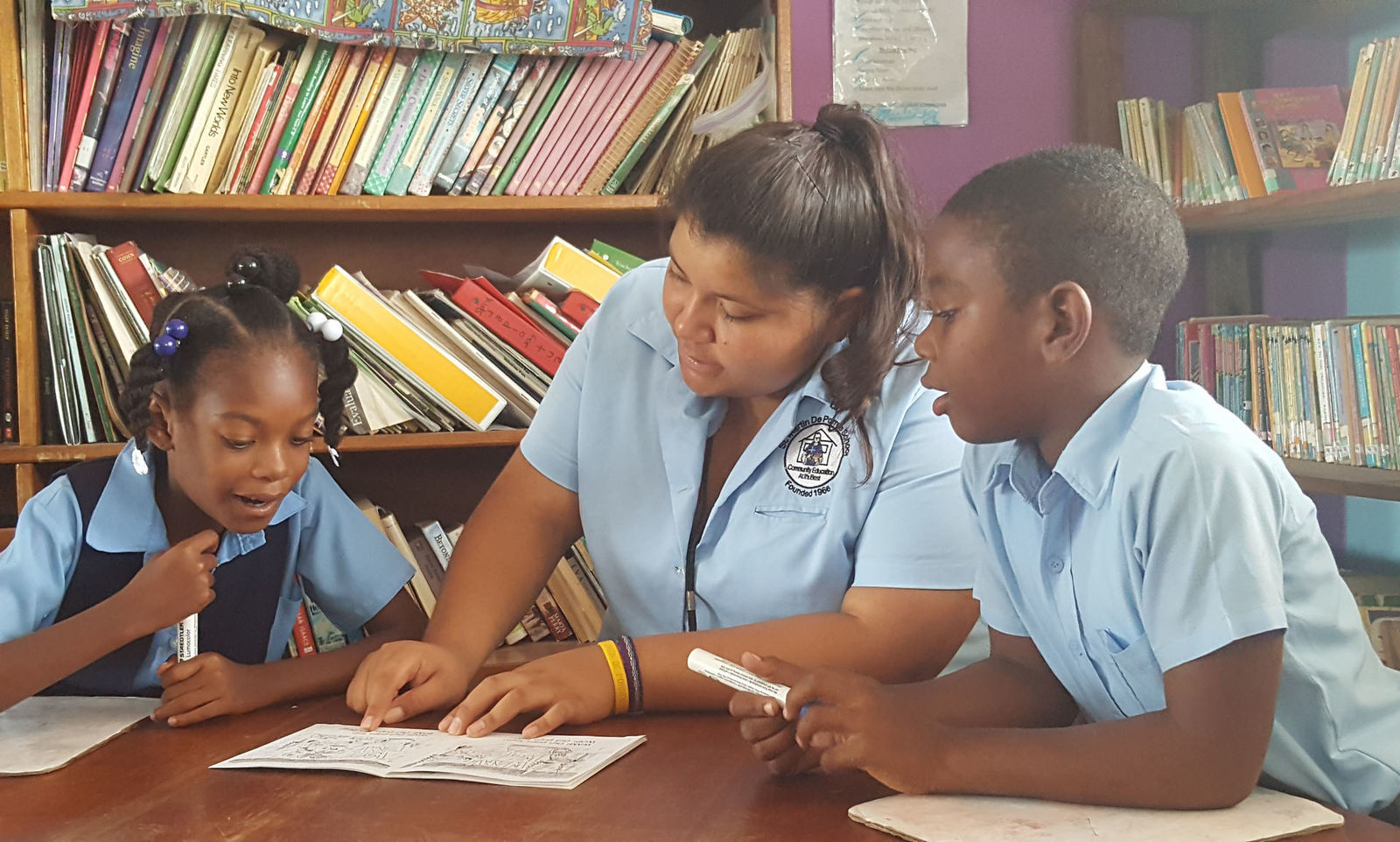 Jesuit Volunteer volunteering internationally tutoring students in Belize. (2016)