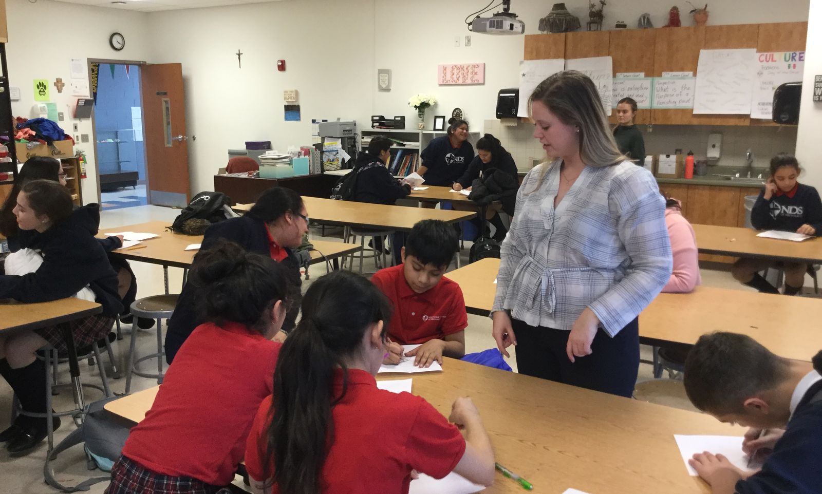 Jesuit Volunteer at Notre Dame School of Milwaukee, Marie McDonald-Hulen assists with the after school program. (2018)